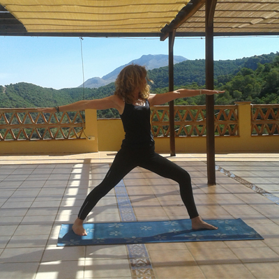 Kim Jones doing yoga in the countryside