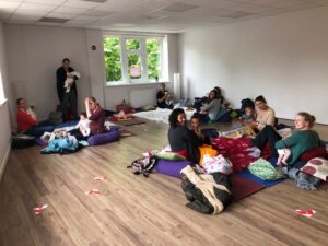 baby massage group in yoga studio